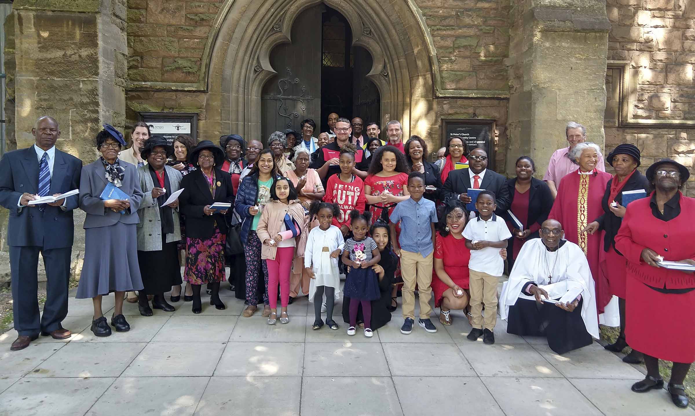 Group of people at the entrance to St Peter’s Highfields Church, Leicester